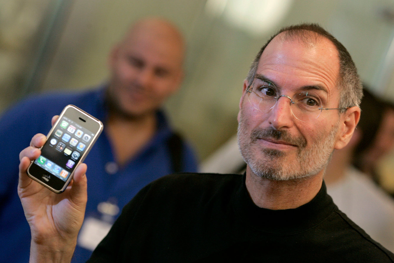 Steve Jobs with the original iPhone (2007)